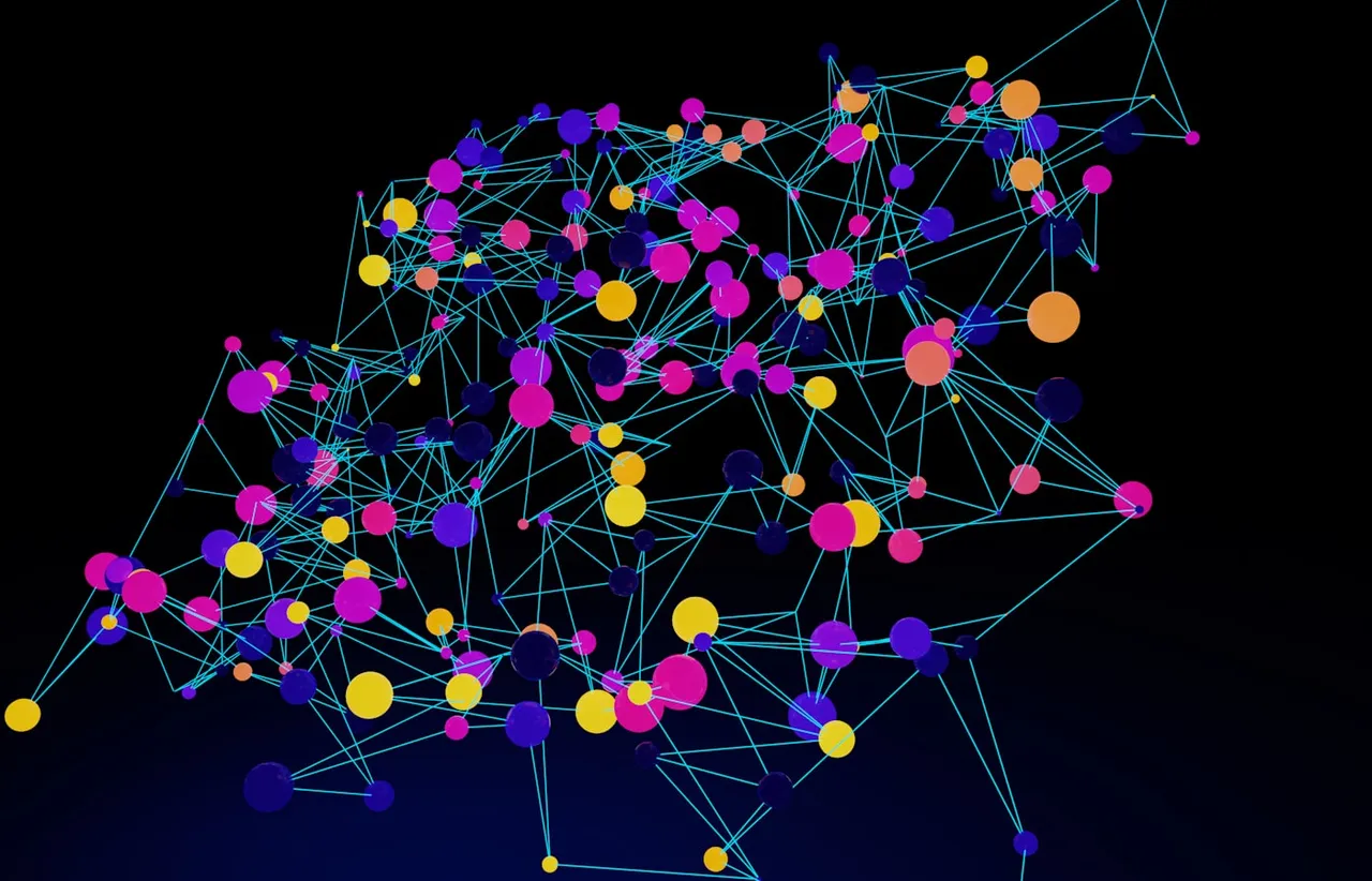 Network of coloured nodes joined by cyan connecting lines on a near black background