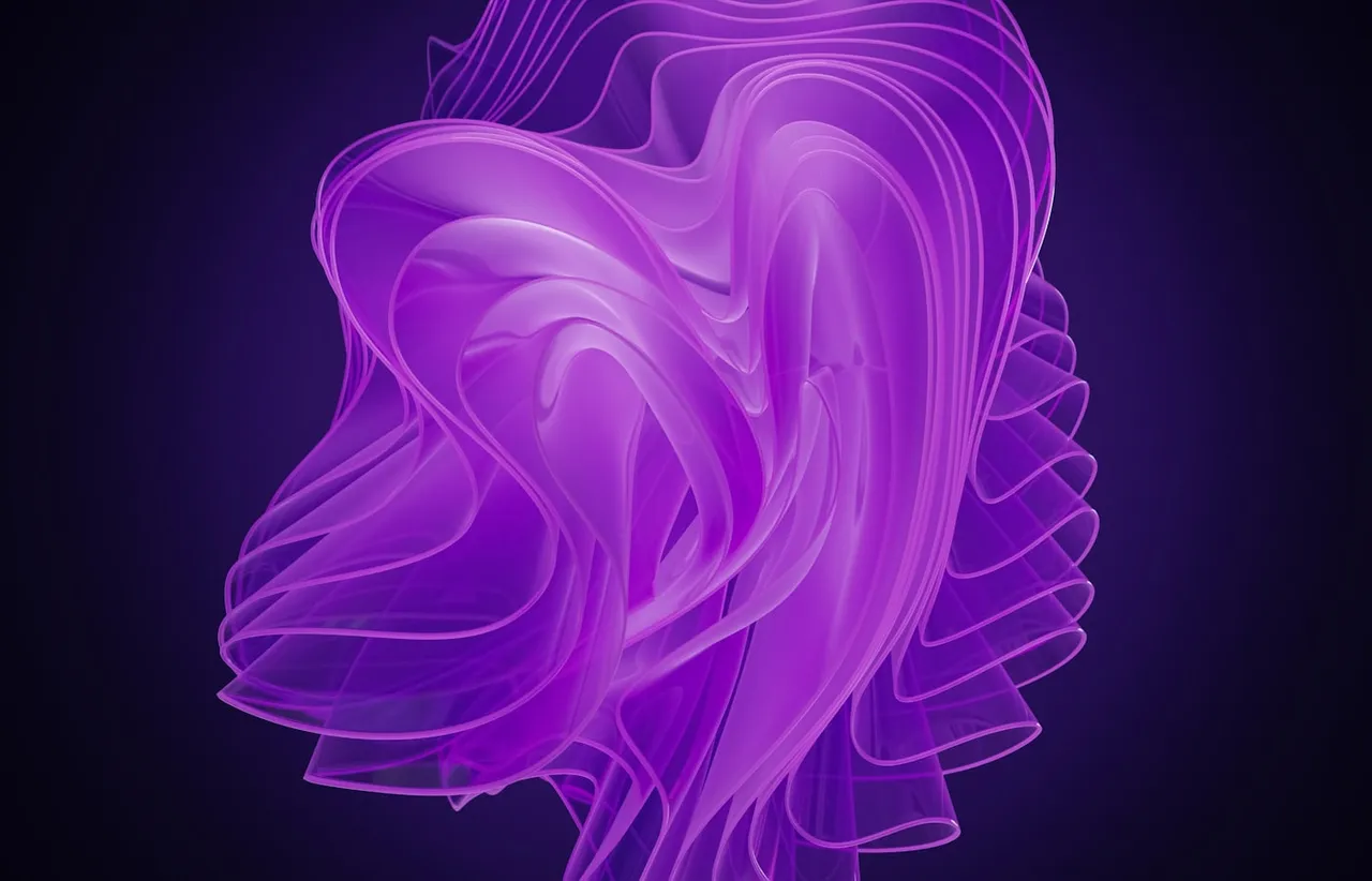 A violet liquid swirl turning slowly against a black background